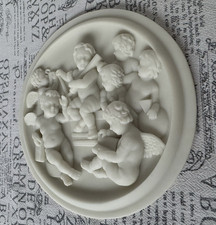 Relief Puttos  m. Flöte