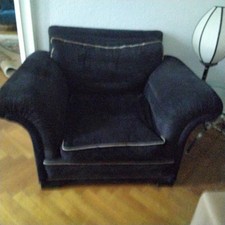 LEDERFAUTEUIL SCHWARZ,mit GOLD  Saum,markanten ARMLEHNSESSEL