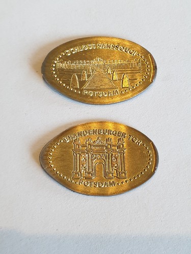 Motive elongated coin - motive,