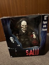 Saw Neca Figur mit Dreirad 