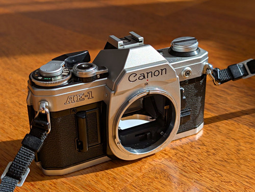 Canon slr body new - ae-1,
