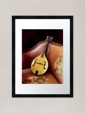 Mandoline auf Couch gerahmter