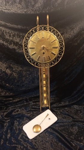 Messingwanduhr vermutlich