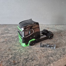 Herpa DAF XG+ Zugmaschine  in Schwarz  / Grün.