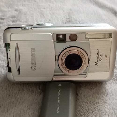 Canon powershot s70 defekt - /,