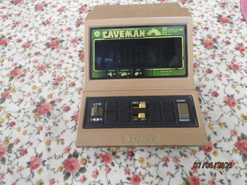Tomy caveman 80s handheld game - caveman,