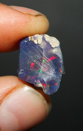 Black opal rough multi - opal, fire