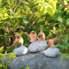 Vogelstatue mit Stone Home
