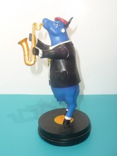 cow  parade  ITEM 7729  cow blues  2006  DEKO  Kuh  spielt Saxophon  H  22 cm 
