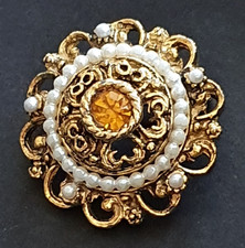 Goldfarbene runde verzierte