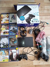 Sony PlayStation 2 Slimline Schwarz Spielekonsole + 8 Spiele + 4 Singstar-Mics