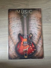 Metallschild zeigt eine Gibson