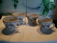 4 Porzellan Tassen , Oscar