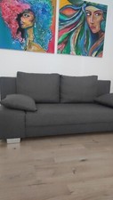 Graues Sofa mit Bettkästen und Schlaffunktion 