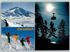 40128583 - St. Moritz Gondel und Skifahrer in Overalls in Corvatsch Graubuenden