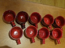 Becher mit Griff in rot für