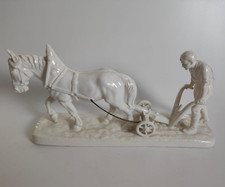 Bauer mit Pferd am Pflug