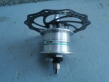 1x Nabendynamo mit Bremsscheibe, Muttern, Unterlegscheibe und Stecker