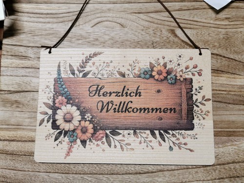Schild herzlich willkommen - herzlich,