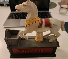 The Rare Vintage Trick Pony Cast Iron Bank, featuring The Book of Knowledge.