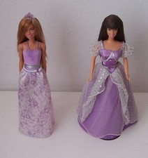 2 Barbiepuppen in lila Outfits