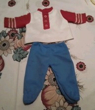 Schildkrötpuppe „Schlummerle 1960 Jahre ca 44 cm groß,Kleidung: Hose und Pulli .