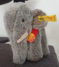 Steiff Jumbo Elefant 1450/12  grau,Knopf in Ohr,Fahne und Brustschild ca. 13cm.
