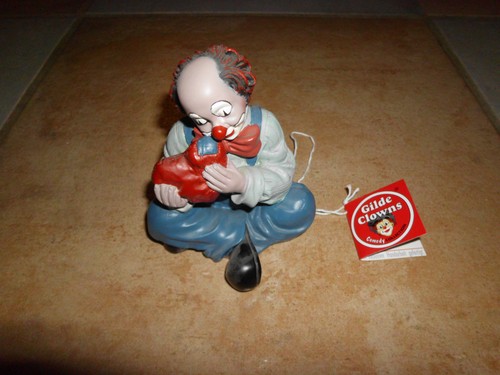 Gilde clown mit herz sitzend - clown,