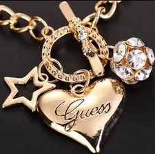 LEICHTES ARMBAND HERZKUGEL STERN GUESS MODESCHMUCK KRISTALLE GOLD PARTYSCHMUCK