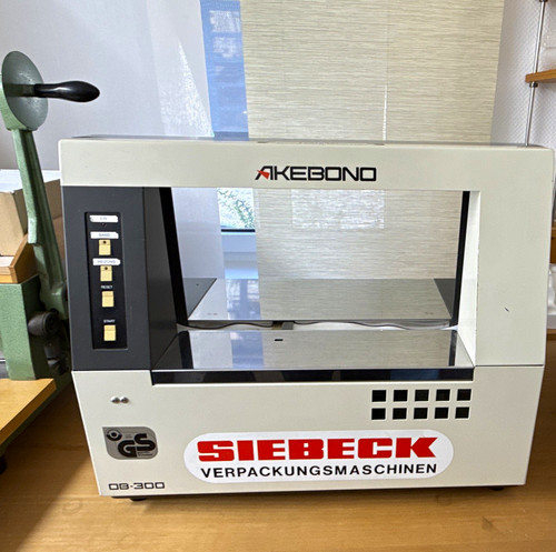 Banderoliermaschine - , •