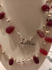 Edelsteinschmuck( auch