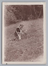 Woman with Apron Feeding Fawn