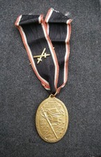 Kriegsdenkmünze 1914-1918 mit Schwertern auf dem Ordensband 100% orig.