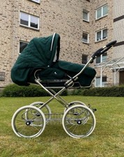 Hesba Kinderwagen in dunkelgrün mit Zubehör in sehr gutem Zustand