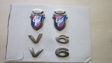2 Ford  Ghia Embleme  mit V6 Abzeichen, siehe Bilder.