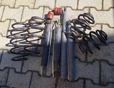 Opel Calibra Original GM Fahrwerk Stoßdämpfer Federn Puffer Vorne + hinten 1997