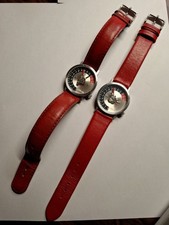 Zwei AKTEO Themenuhren "Motorrad" mit Original Prospekt von 1990