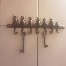 Hakenleiste "Katzen" aus Gußeisen braun