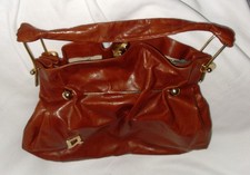 Schultertasche von Linea R in Braun und Gold