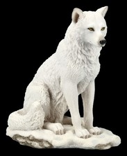 Weiße Wolf Figur sitzend -