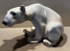 Porzellanfigur sitzender