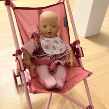 Puppe mit Buggy und Zubehör