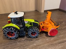 BRUDER 03017 - Claas Axion 950 mit Schneeketten & Schneefräse