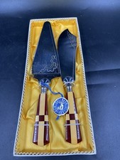 Tortenmesser und Tortenheber Fribal Stahl Griff aus Bakelit (?) rot und gelb