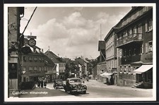 AK Crailsheim, Wilhelmstraße mit Geschäft von Fritz Reuter und Automobil 