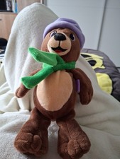 Milka Bär Lila Mütze Grüner