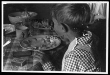 Boy Eating Soup with Bib at
