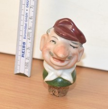 schöner alter Schnapsausgießer, Kopf aus Porzellan