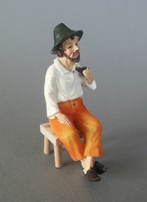 Hirte mit Pfeife Opa sitzend