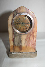 Marmorstein mit eingesetzter mechanischer Uhr mit Wecker, Baujahr ca. 1950, Vita